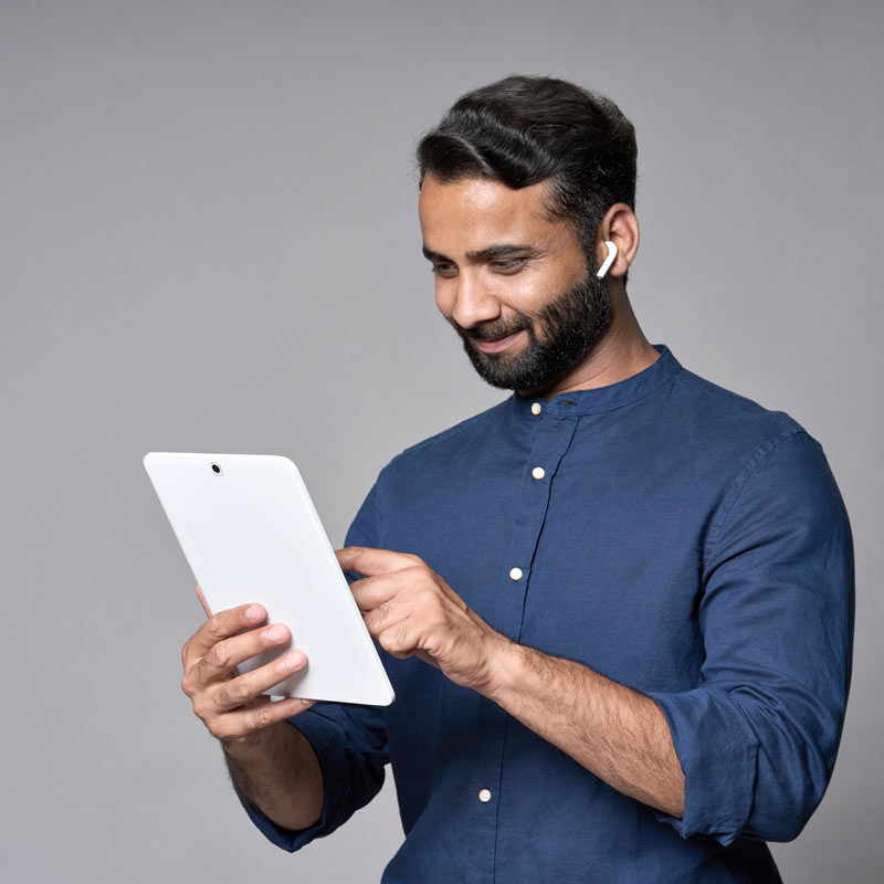 happy-indian-business-man-using-tablet-isolated-on-2022-09-23-20-29-30-utc